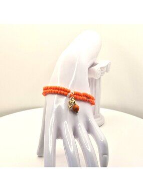 Orange Beaded Stretch Bracelet With Gold Tone Heart And Charm Accent